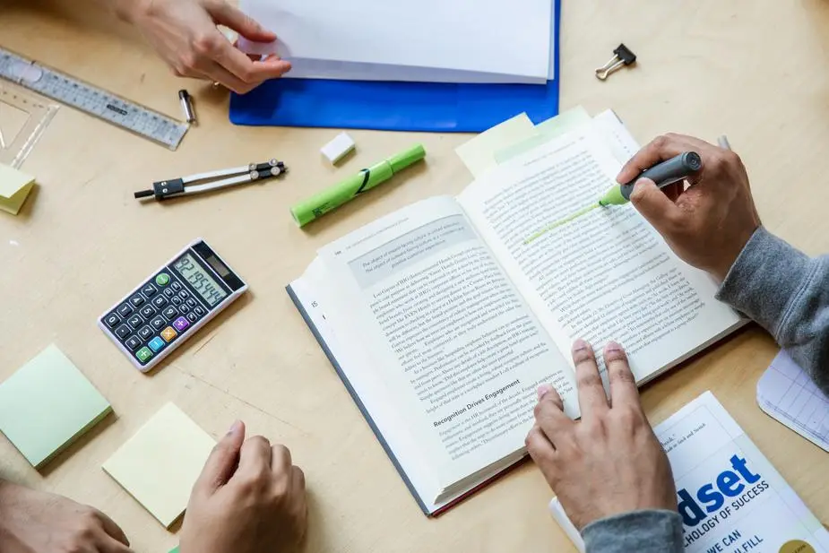 three students working flatlay.jpg
